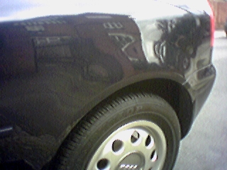 The backend of our car, recently restored after minor bump that could have happened to anyone and it wasn't down to my driving skills oh no