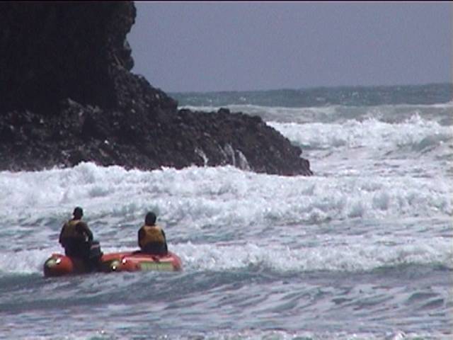 The sea and a boat at Piha