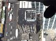 View of a building below, throught the glass floor of the skytower